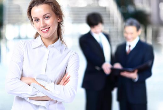 Business lady with positive look and cheerful smile posing for the camera