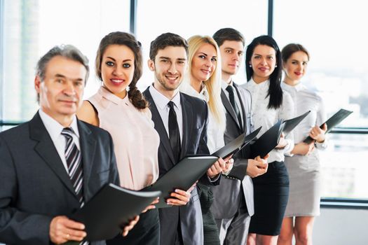 group of businessmen discussing the policy of the company in the office.