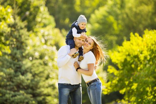 portrait of happy family walking in Park