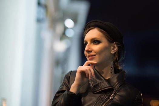 Mysterious beautiful girl. A walk through the city.