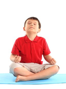 Children's yoga. The little boy does exercise.