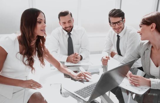 business team uses a laptop to check the results of their work .office weekdays