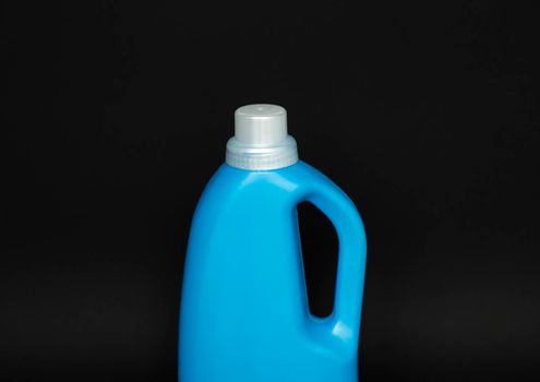 Blue plastic bottles of cleaning products. Laundry container, merchandise template