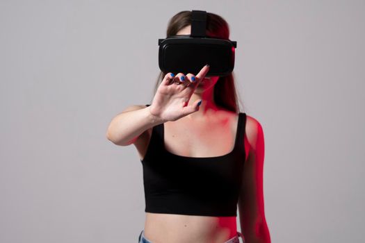 Woman using VR headset and experiencing virtual reality