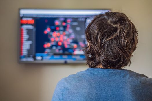 Young man checks coronavirus sars-cov-2 covid-19 global cases situation online. Coronavirus outbreak in United States of America and World.