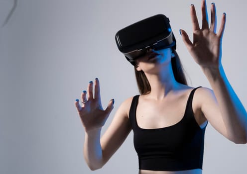 Young attractive brunette woman wearing VR goggles and enjoying amazing experience playing and having fun in virtual reality video game