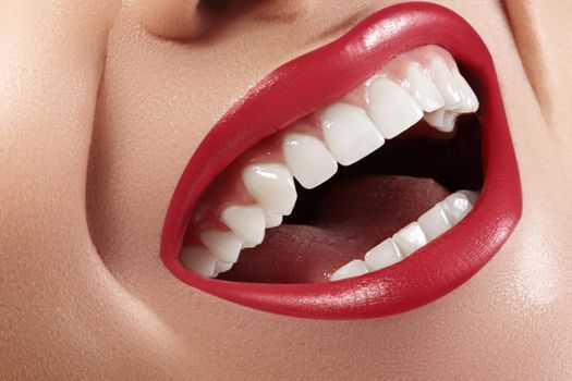 Cropped half face portrait of woman. Closeup Dental Beauty. Beautiful Macro with perfect White Teeth. Sexy Fashion Lips Red Make-up. Whitening Tooth and Wellness Treatment