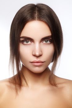 Beautiful face of young woman. Skincare, wellness, spa. Clean soft skin, healthy fresh look. Natural daily makeup.