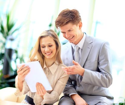 Business team interviewing young applicant in bright office