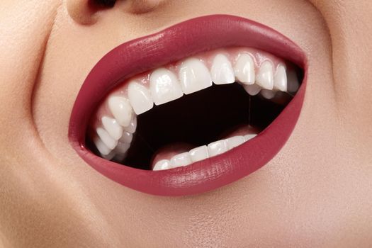 Macro Happy Female Smile with Healthy White Teeth. Bright Red Lips Make-up. Stomatology and Beauty Treatment, Whitening. Clean Skin