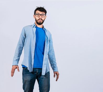 Surprised bearded man looking into the camera, surprised and discovered young man looking at the camera, discovered man with a surprised face