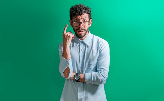 Confused scared latin man, guy with scared and confused face.