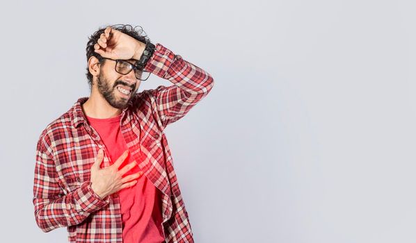 Man with heart pain on isolated background, man with chest pain, on isolated background, tachycardia