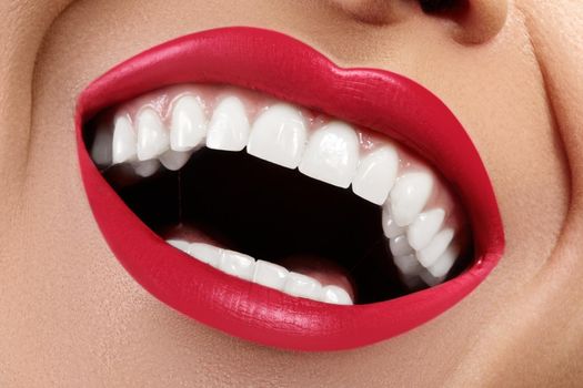 Macro Happy Female Smile with Healthy White Teeth. Bright Red Lips Make-up. Stomatology and Beauty Treatment, Whitening. Clean Skin