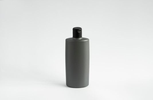 Gray bottle of shampoo, conditioner, hair rinse, mouthwash, on a white background