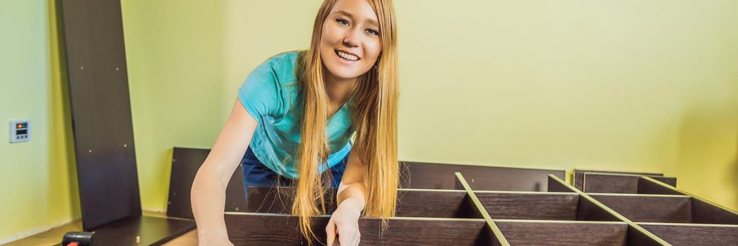 Caucasian woman using screwdriver for assembling furniture. BANNER, LONG FORMAT