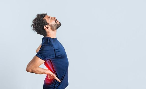 Man with spine problems, person with back problems on isolated background, lumbar problems concept, a sore man with back pain