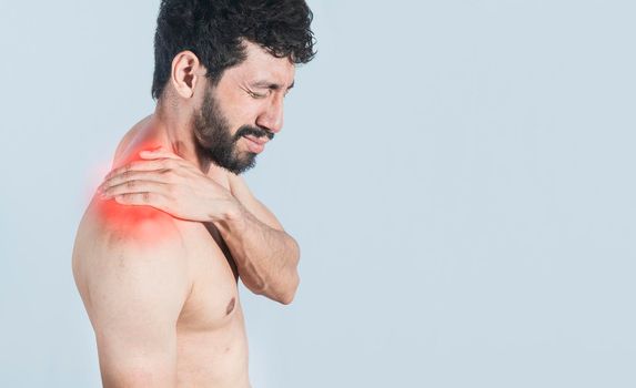 Neck pain and stress concept, shirtless man with neck muscle pain, Close-up of a man with neck pain, a man with neck pain on an isolated background.