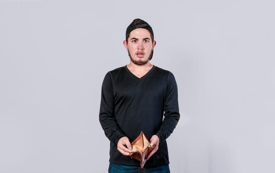 unhappy and surprised man looking in an empty wallet, man seeing his empty wallet, young man with wallet without money