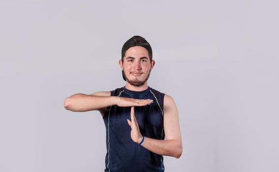 Man making time out gesture, latin guy making time out gesture