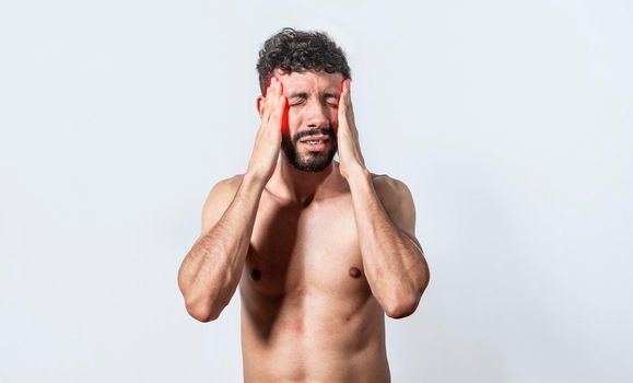 Shirtless man with headache, person with headache on isolated background, man in pain holding his head, migraine man concept