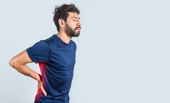 Man with spine problems, person with back problems on isolated background, lumbar problems concept, a sore man with back pain