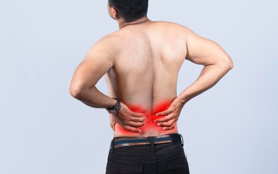 Person with back problems on isolated background, lumbar problems concept, A man with spine problems, a sore person with back pain
