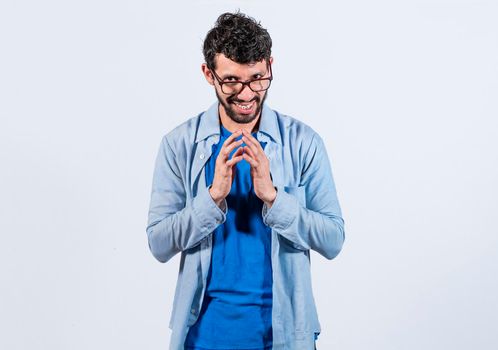 Cunning man rubbing his hands on isolated background, person rubbing his hands planning something, concept of cunning man planning something