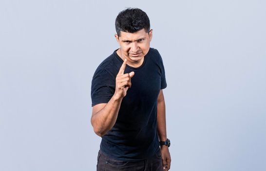 Concept of angry person threatening head on, Hey you, be careful. people looking angry and warning, angry man threatening finger at camera