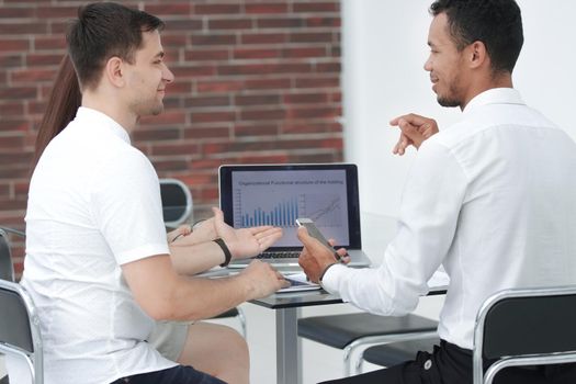 close up.business team analyzing the data of the annual report. people and technology