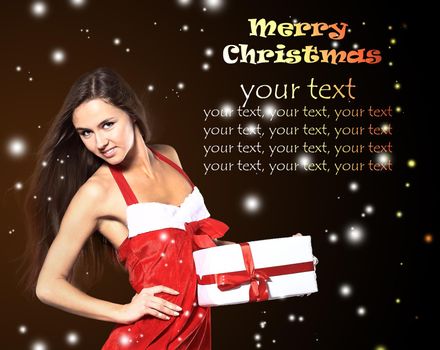 Girl with a new year gift on a dark background