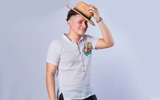 Man with hat and beach shirt on isolated background, concept of a man with hat and beach shirt