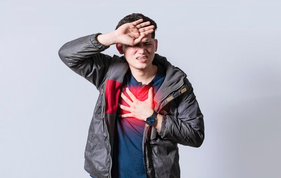 Man with heart pain on isolated background, man with chest pain, on isolated background, tachycardia