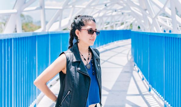 Portrait of urban girl on a bridge, portrait of an attractive girl on a bridge, Lifestyle of attractive urban girl on a bridge, concept of a lifestyle girl