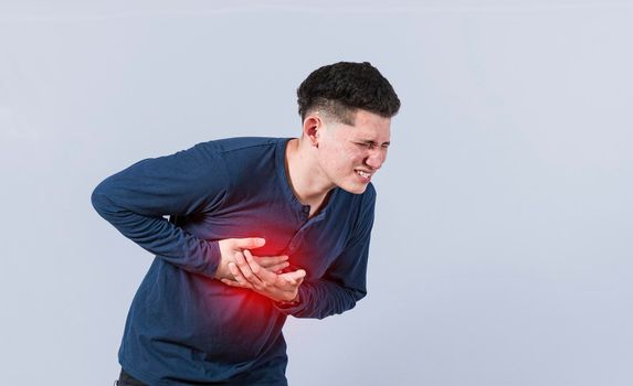 Man with chest pain isolated, man with tachycardia, Man with heart pain on isolated background, young man with chest pain isolated