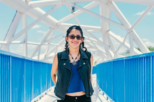 Portrait of urban girl on a bridge, portrait of an attractive girl on a bridge, Lifestyle of attractive urban girl on a bridge, concept of a lifestyle girl