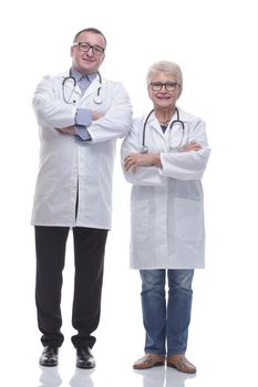 in full growth. two experienced doctors standing together. isolated on a white background