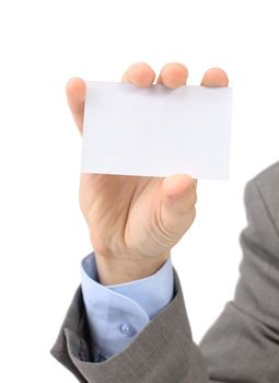 A businessman in a grey suit and a blue shirt shows, professional business card with a copy of the space, small-scale department of the field. Isolated on a white background.