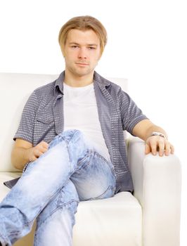 Portrait of the young man in white on sofa