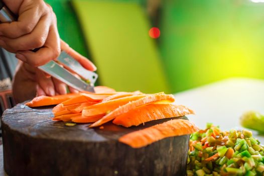 close up of hands cutting vegetables with copy space, cutting vegetables on the table