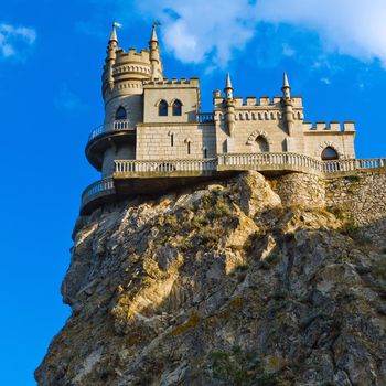 Medieval castle agains blue sky with clouds. Swallow's Nest, The Crimean Peninsula, Ukraine.