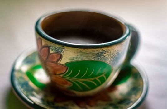 Photo of a cup with coffee on white background, cup of coffee with smoke on white background