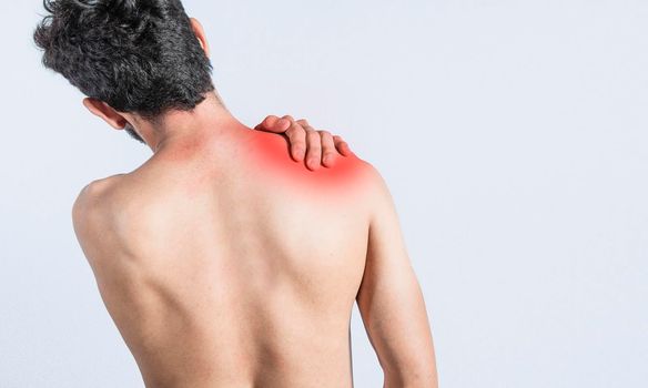 Close up of man with neck pain, a man with neck pain on isolated background, neck pain and stress concept, man with muscle pain