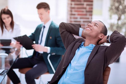 dreaming businessman on blurred background office.