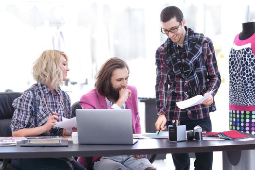 team of designers discussing new ideas in the Studio.