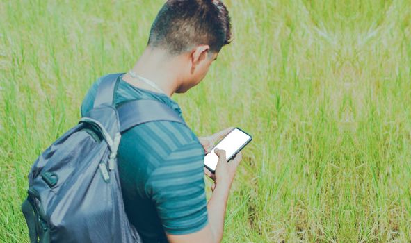 Close up of a man with cell phone in hand, close up shot of a person checking his cell phone, young guy with cell phone in hand with copy space