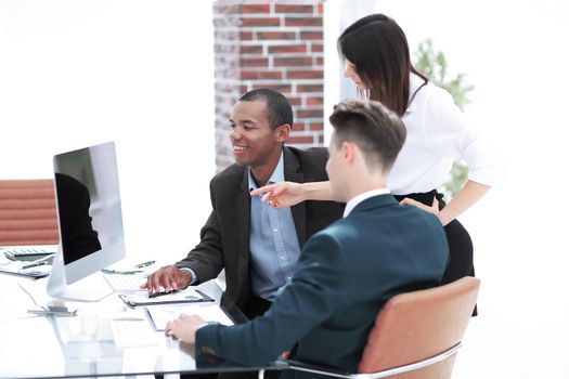 business team discussing work problems sitting at their Desk in the office