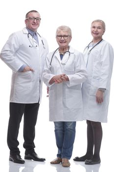 in full growth. friendly female doctor and her colleagues standing together. isolated on a white background