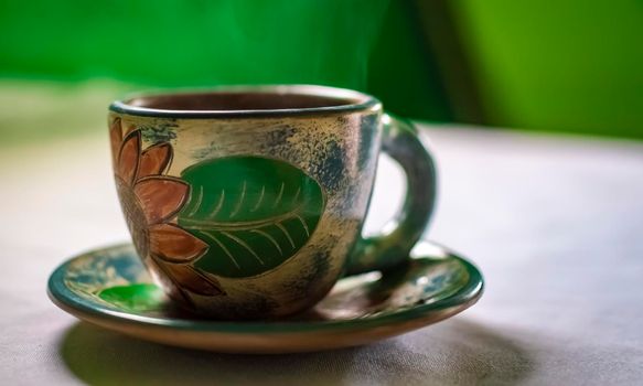 Photo of a cup with coffee on white background, cup of coffee with smoke on white background