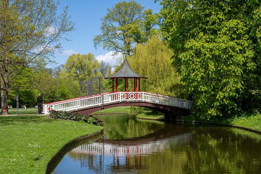 Copenhagen, Denmark - May 07, 2022: Wooden bridge to the Chinese Pavilion in Frederiksberg Gardens